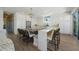Beautiful kitchen with white cabinetry, center island, breakfast bar, and stainless steel appliances at 870 N Shore Dr, Anna Maria, FL 34216