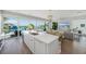 Bright open kitchen with a large island, seating, and stunning outdoor views at 870 N Shore Dr, Anna Maria, FL 34216