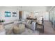 Bright living room with cozy seating and open kitchen concept at 870 N Shore Dr, Anna Maria, FL 34216