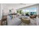 Open-concept living space with ocean views and adjacent kitchen at 870 N Shore Dr, Anna Maria, FL 34216