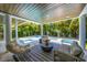 Stunning outdoor living space featuring a pool, spa, lounge area, and lush tropical landscaping at 870 N Shore Dr, Anna Maria, FL 34216