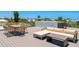 Spacious rooftop deck with dining and lounging areas offering panoramic views of the surrounding neighborhood at 870 N Shore Dr, Anna Maria, FL 34216