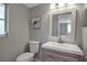 Bright bathroom features a modern vanity, a framed mirror, and a turtle art piece enhancing its appeal at 927 Lemon Bay Dr, Venice, FL 34293