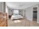 Bedroom featuring tile floors, neutral paint, ceiling fan and access to an ensuite bathroom at 927 Lemon Bay Dr, Venice, FL 34293