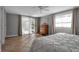 Bedroom featuring tile floors, neutral paint, and access to an enclosed porch at 927 Lemon Bay Dr, Venice, FL 34293