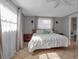 Bedroom with natural light, tile floors, neutral paint, and a ceiling fan at 927 Lemon Bay Dr, Venice, FL 34293