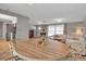 Open-concept dining area with tile flooring, wicker chairs, and access to the kitchen at 927 Lemon Bay Dr, Venice, FL 34293