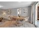Dining room with tile floors, stylish wicker chairs, and plenty of natural light at 927 Lemon Bay Dr, Venice, FL 34293