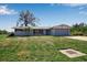 Charming single-story home with a two-car garage, a well-kept lawn, and mature landscaping at 927 Lemon Bay Dr, Venice, FL 34293
