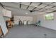 Spacious garage featuring a laundry area, utility sink, and side-entry door at 927 Lemon Bay Dr, Venice, FL 34293