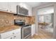 Kitchen featuring stainless steel appliances and an adjacent dining area at 927 Lemon Bay Dr, Venice, FL 34293