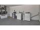 Garage featuring laundry area with washer, dryer, and utility sink at 927 Lemon Bay Dr, Venice, FL 34293
