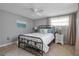 Cozy bedroom featuring neutral paint, carpet floors, large windows, and an inviting decor at 927 Lemon Bay Dr, Venice, FL 34293