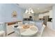 Bright dining area next to kitchen featuring a white table and chairs at 13324 Purple Finch Cir, Lakewood Ranch, FL 34202
