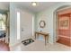 Inviting home foyer with tiled floors, neutral paint, and decorative accents at 13324 Purple Finch Cir, Lakewood Ranch, FL 34202