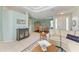 Open-concept living area featuring tile flooring, neutral decor, and access to dining room at 13324 Purple Finch Cir, Lakewood Ranch, FL 34202