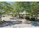 View of a large picnic pavilion and playground surrounded by trees at 13324 Purple Finch Cir, Lakewood Ranch, FL 34202