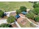 Aerial photo of play structures and swing sets in a park surrounded by trees and grass at 13324 Purple Finch Cir, Lakewood Ranch, FL 34202