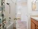 Bathroom showcasing wooden cabinets, light countertops, toilet, and a shower with curtain at 2345 Felicity Pl, North Port, FL 34289