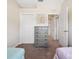 Bedroom with gray dresser, closet, and doorway leading to the hall at 2345 Felicity Pl, North Port, FL 34289