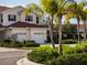 Charming townhome with lush landscaping, attached two-car garage and beautiful curb appeal at 2345 Felicity Pl, North Port, FL 34289