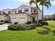 Inviting townhome with lush landscaping, attached two-car garage and beautiful curb appeal at 2345 Felicity Pl, North Port, FL 34289