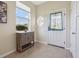 Inviting foyer with tile flooring, natural light and a view of the front door at 2345 Felicity Pl, North Port, FL 34289