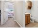 Hallway view to the bathroom and bedroom with carpet and neutral colors at 2345 Felicity Pl, North Port, FL 34289