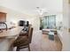 Inviting living room with neutral walls, plush carpeting, and comfortable seating arrangement at 2345 Felicity Pl, North Port, FL 34289