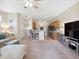 Bright living room with barstool seating and a partial kitchen view, perfect for entertaining guests at 2345 Felicity Pl, North Port, FL 34289
