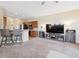 Open living space with a partial view of kitchen, neutral walls and comfortable furniture at 2345 Felicity Pl, North Port, FL 34289