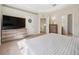 Bright main bedroom with tray ceiling, carpet, furniture and ensuite bathroom access at 2345 Felicity Pl, North Port, FL 34289