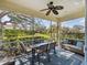 Outdoor patio with comfortable seating, ceiling fan and beautiful manicured lawn at 2345 Felicity Pl, North Port, FL 34289