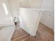 Carpeted staircase leading downstairs into the main level at 2345 Felicity Pl, North Port, FL 34289
