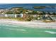 Breathtaking aerial view of beachfront condos and pristine shoreline at 4234 Gulf Of Mexico Dr # E2, Longboat Key, FL 34228