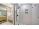 Modern bathroom features a frameless glass shower with a rainfall shower head at 4234 Gulf Of Mexico Dr # E2, Longboat Key, FL 34228