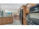 Open concept kitchen and living room featuring stainless steel appliances, and granite countertops at 4234 Gulf Of Mexico Dr # E2, Longboat Key, FL 34228