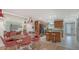 A bright, airy eat-in kitchen with wood cabinets, stainless appliances, and a mirrored wall to enhance the space at 4234 Gulf Of Mexico Dr # E2, Longboat Key, FL 34228