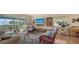 Comfortable living room featuring stylish furniture and a sliding door leading to a waterfront balcony at 4234 Gulf Of Mexico Dr # E2, Longboat Key, FL 34228