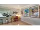 Bright office space with desk, decor, wood flooring, and natural light streaming through the window at 4234 Gulf Of Mexico Dr # E2, Longboat Key, FL 34228