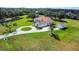 Aerial view of the estate with long private driveway and adjacent pond at 5750 Saddle Oak Trl, Sarasota, FL 34241