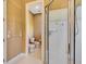 This bathroom boasts a walk-in shower with glass doors, tile walls, and a separate toilet room at 5750 Saddle Oak Trl, Sarasota, FL 34241