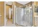 This bathroom showcases a glass-enclosed shower, separate toilet room, and classic neutral decor at 5750 Saddle Oak Trl, Sarasota, FL 34241