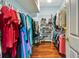 This walk-in closet features wire shelving and wood floors for optimal organization at 5750 Saddle Oak Trl, Sarasota, FL 34241
