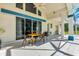 Covered patio featuring a dining table and chairs, ideal for outdoor entertaining at 5750 Saddle Oak Trl, Sarasota, FL 34241