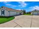 Large driveway with ample parking, leading to a spacious three-car garage at 5750 Saddle Oak Trl, Sarasota, FL 34241