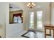 Elegant foyer entrance with marble floors and chandelier lighting at 5750 Saddle Oak Trl, Sarasota, FL 34241