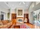 Bright living room with hardwood floors, fireplace, and backyard access at 5750 Saddle Oak Trl, Sarasota, FL 34241