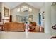 Bright living area with high ceilings, large windows, and a view of the pool at 5750 Saddle Oak Trl, Sarasota, FL 34241