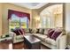 Comfortable living room with large sectional sofa and window views at 5750 Saddle Oak Trl, Sarasota, FL 34241